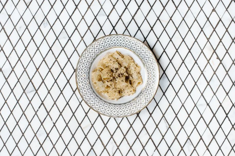 Cacio e pepe, the simple Roman dish of cheese, cracked pepper and al dente pasta, appears on restaurant menus all around the United States. It’s not actually on the menu at this long standing Washington D.C. hotspot anymore, but chef/owner Aaron Silverman’s version is still one of the best around. The simple dish is made to somewhat exacting specifications: water salted just right, noodles undercooked enough so the starch properly binds to the butter, coarsely ground Tellicherry peppercorns that are big enough to offer spicy pops of flavor. Most importantly, Silverman instructs his chefs to grind at least 50 grinds of pepper atop each dish. Go early or go late and ask nicely if the chefs will send one out.