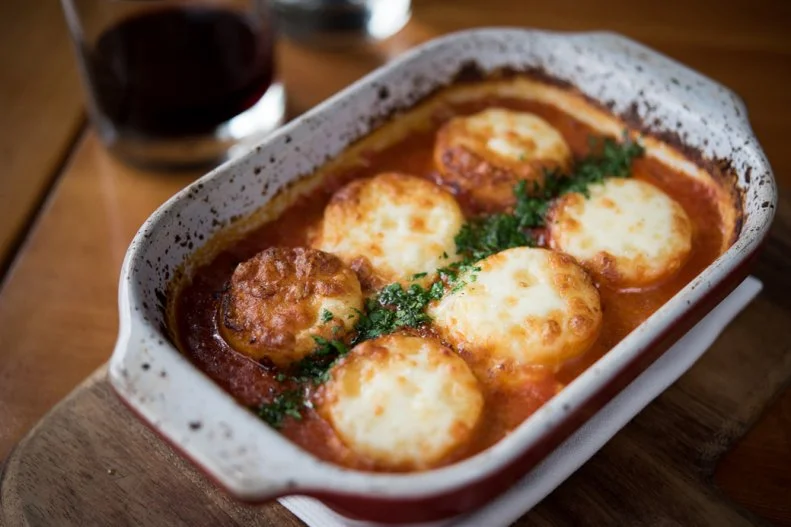 Between nominations and semifinalist slots, Ethan Stowell has nearly a dozen James Beard nods under his belt. The Seattle-based chef and restaurateur is basically the godfather of Italian cuisine in the city, possibly the entire Pacific Northwest. In spite of the freshly extruded rigatoni, linguine and other shapes, the hand-formed Gnocchi Alla Romana is still the fan favorite at pasta-centric Tavolàta. Forgoing the traditional potato, these Roman-style dumplings are made from mostly Semolina wheat, formed into a flat biscuit-like form. Here, those rounds are layered with mozzarella and tomato sauce and cooked until the top is crisp and bubbly in a casserole dish.