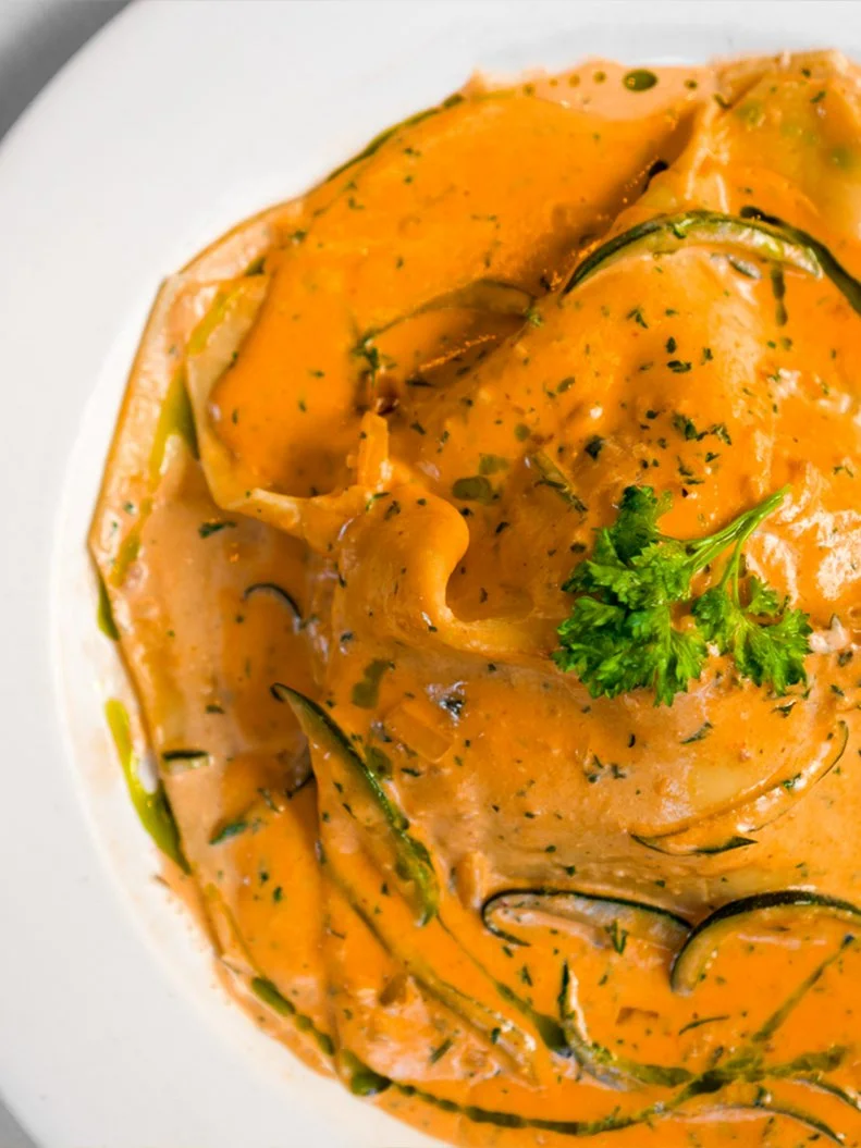 Set in Boston’s Italian enclave, the North End, this special-occasion status spot has been serving elevated Italian fare since 1993. Terramia’s diverse menu offers innovative versions of seasonal classics that are certainly worth exploring, though many of its regulars just can’t pass up the signature raviolone aperto. The giant open-faced ravioli serves as a delicate bed for scallops, shrimp and zucchini blanketed with a sweet and creamy lobster-mascarpone reduction. The candlelit restaurant is small and its tables are still very coveted after all these years, so it's best to make a reservation if you want to taste this iconic dish.