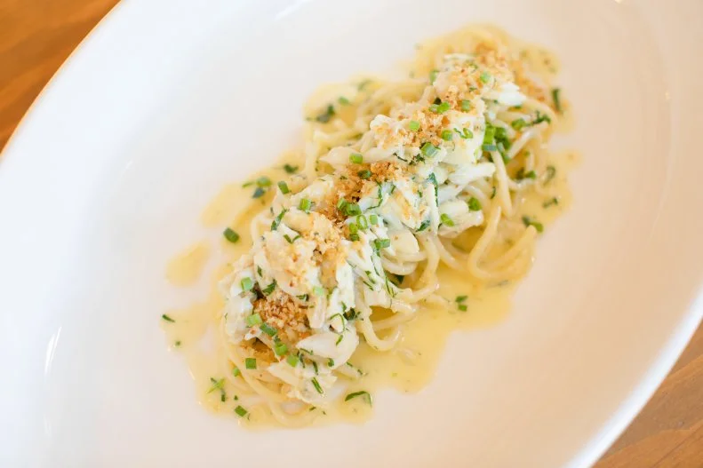 Set in a historic building on a quiet corner in Charleston’s Cannonborough/Elliotborough neighborhood, chef Ken Vedrinski’s remarkable restaurant blends modern Tuscan-style fare with a bit of Lowcountry flair. Start with the warm cauliflower sformatino before slurping up the taglioni. Like all of the pasta on Trattoria Lucca’s menu, the thin strands of long noodles are made in-house with organic semolina flour from Central Mill in Logan, Utah, and Molino Spadoni in Emilia-Romagna, Italy. Epitomizing the Charleston-Italian fusion (for lack of a better term), the tagliolini is combined with sweet blue crab, bread crumbs, an anchovy-heavy Italian-style fish sauce called colatura di alici and a bright burst of lemon.