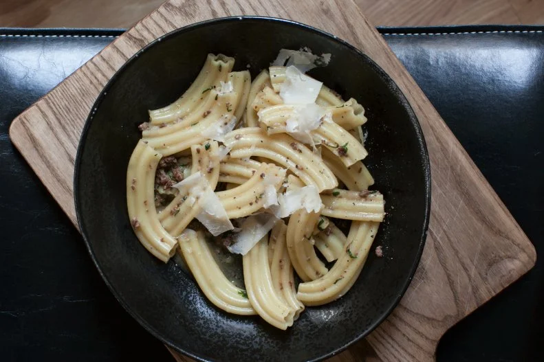 Upland chef Justin Smillie has become a national star for his work with pasta dough. The most famous of all his remarkable dishes is the Estrella, star shaped tubes of pasta with chicken liver that is so well prepared, even the most diehard offal haters can get behind it. Smillie came up with a technique that gives the liver a meaty texture rather than the powdery finish that can be off-putting for many. The organ’s earthy flavor melds together with shallots, rosemary and sage as its broken into small pieces that resemble the meat in Bolognese. The pan is deglazed with sherry to cut the richness and filled out with chicken stock, then the chewy pasta is thrown in.