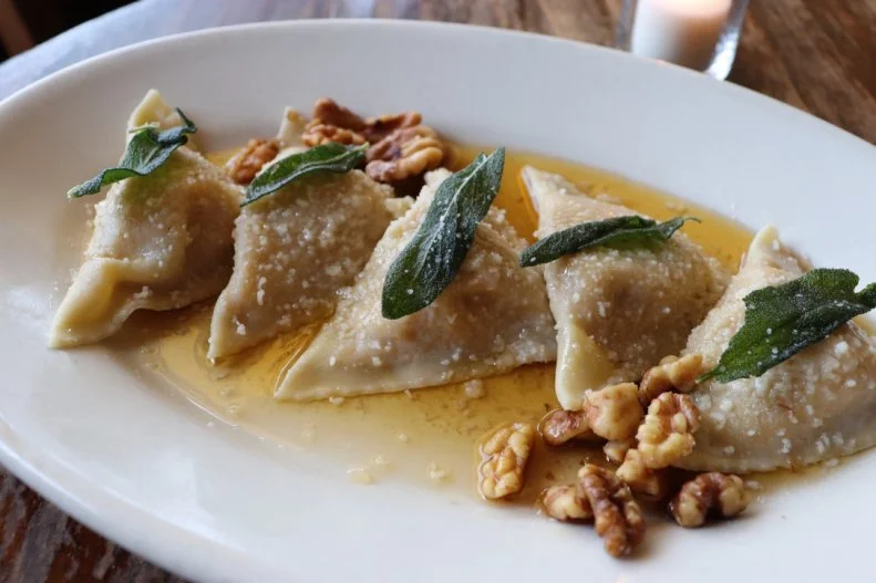 Well before South Congress became one of Austin’s hottest shopping and dining districts, Vespaio was there, churning out handmade, locally sourced Italian fare. It could be said that the constantly busy place had a little something to do with the neighborhood’s transformation. One of its greatest hits is the pansotti di zucca, half-moon-shaped pasta filled with butternut squash, crunchy crumbles of amaretti biscuits and sage, drenched in a sweet and savory sage-brown butter sauce with walnuts, crisp fried sage and grated Parmigiano-Reggiano. Don’t be surprised if you see an order heading to every table.