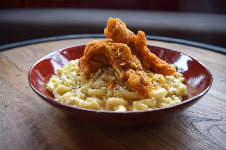 Musicians Joey and Gavin Degraw brought their passion for music and food together at Nashville Underground, a massive space with three stages, multiple bars, a rooftop, and two different restaurant concepts. But just because the space is large, doesn’t mean they don’t take their food seriously. The duo is all about the Nashville hot chicken, locally sourced and smoked in house daily, on dishes like Mama Lynee’s truffle mac and cheese and even a hot chicken ramen.