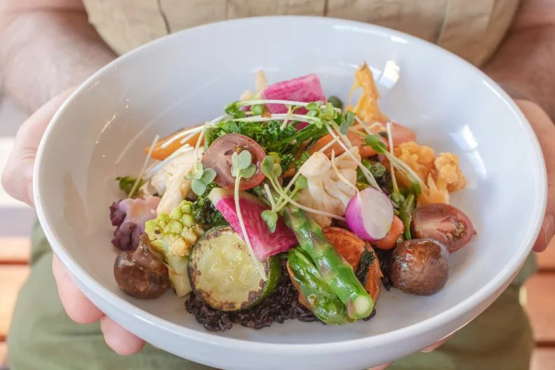The light, bright and colorful Forbidden Rice Bowl packs a punch of healthy carbs to fuel your afternoon at the Phoenix Public Market Café. Black jasmine forbidden rice tossed with a sweet and spicy vinaigrette adds substance to the seasonal vegetables from the adjacent farmer’s market, with the option to add salmon, rotisserie chicken or NY strip steak.