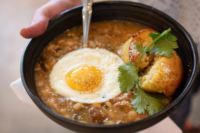 Culinary Dropout caters to both college and young parental crowds in a huge, hip space. Their Southwestern-style green chile and pork stew is both warm and hearty. It comes served with a slightly sweet hunk of cornbread and a fried egg on top. The results are a creamy, hearty, bean-laden stew that appeals on a cold winter day in the desert or, for Phoenix natives, anytime it’s less than 70 degrees.