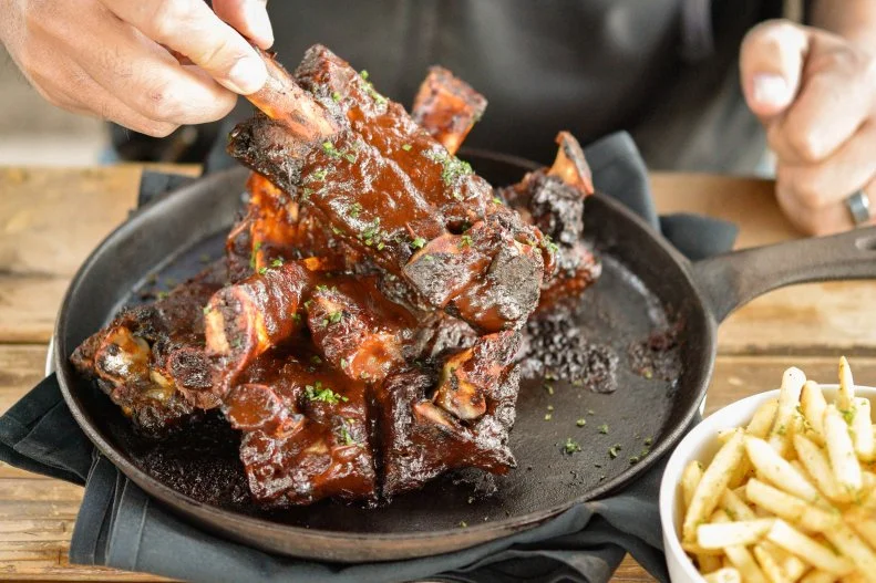 The beef ribs with Mole Negro BBQ Sauce at Ocotillo are from ranches native to the Sonoran Desert. The Ocotillo Chicken utilizes local honey, chiles, pecans and citrus cooked on mesquite and pecan wood from the pecan orchards between Phoenix and Tucson. Chef Walter Sterling loves food and he loves making people happy — and it shows.