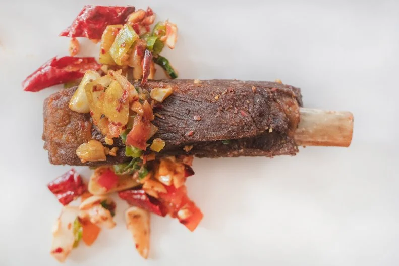 Original Cuisine opened to great anticipation and fanfare as a well-executed expression of Szechuan cuisine. Modern interpretations of classic dishes abound, including dry pot-style spare ribs, which are a little bit salty and a little bit crunchy. The peanuts, veggies and chiles spooned over the top add a little kick of crunch and spice.