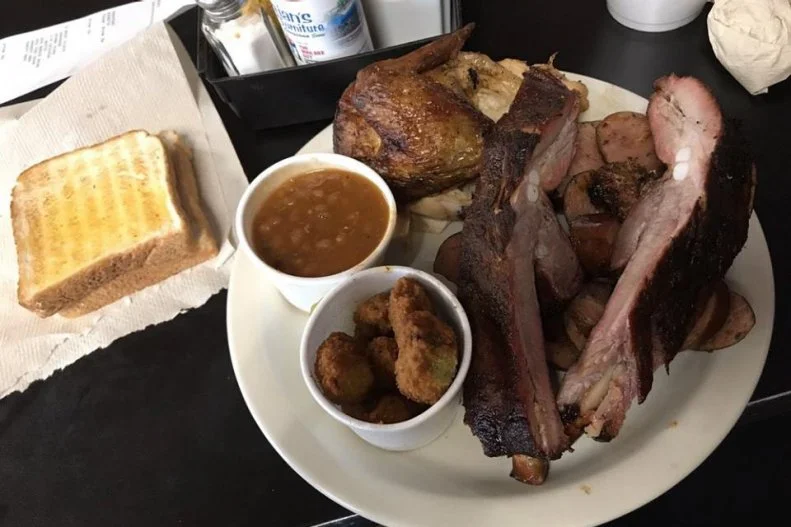 The self-proclaimed “best BBQ dive” in Louisiana, Cou-yon's Cajun Bar-B-Q, a Port Allen staple, is famous for smoked meats and homemade BBQ sauces, where South Texas meets Cajun in one bite.
