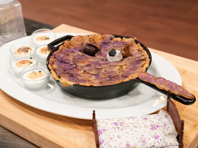 Horizontal shot of Jocelyn Jung’s Pink Peppercorn and Pineapple Pie with Toasted Marshmallow Crème, as seen on Halloween Baking Championship, Season 5.