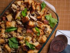 There's something for everyone in our festive stuffing. It's filled with satisfying ingredients like sausage and mushrooms, plus classic Thanksgiving flavors like onion, celery and lots of chopped herbs. We like it best when baked in a casserole dish and served alongside the turkey. This is also the safest way to prepare it.