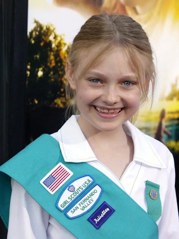 BURBANK, CA - SEPTEMBER 22:  Actress Dakota Fanning arrives for her induction ceremony into the Girls Scouts of the USA and a special screening of her movie "Dreamer: Inspired by a True Story" at the AMC Burbank 16 on September 22, 2005 in Burbank, California.  (Photo by Michael Buckner/Getty Images)