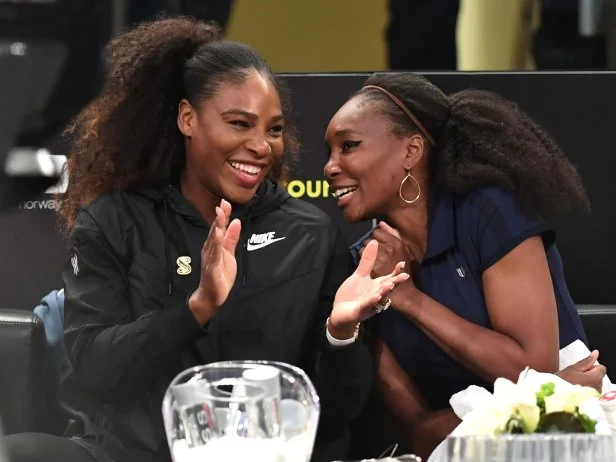 Serena Williams (L) of the US speaks with her sister Venus WIlliams (R) before their matches in the Tie Break Tens New York tournament at Madison Square Garden March 5, 2018, featuring eight of the tours top female players competing for the $250,000 winners prize. / AFP PHOTO / TIMOTHY A. CLARY        (Photo credit should read TIMOTHY A. CLARY/AFP via Getty Images)