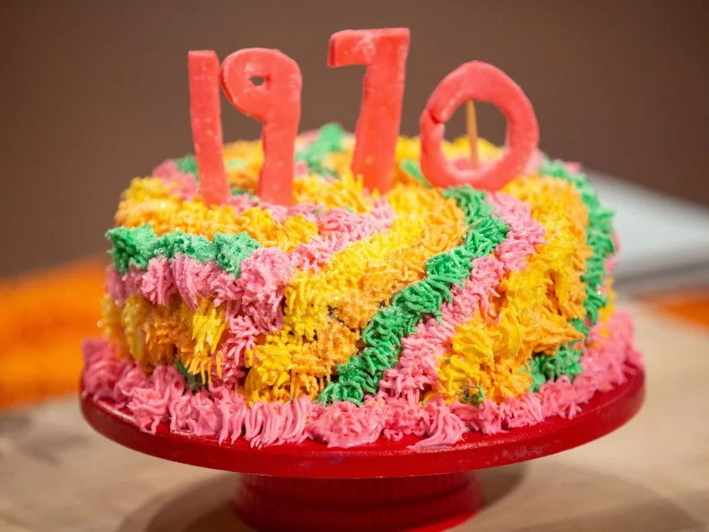 Avner's final dish - CHOCOLATE,CHOCOLATE CAKE WITH MANDARIN CHOCOLATE BUTTERCREAM FILLING AND VANILLA RAINBOW BUTTERCREAM DECOR,TWIST: CANNED MANDARIN ORANGES, as seen on Kids Baking Championship, Season 8.