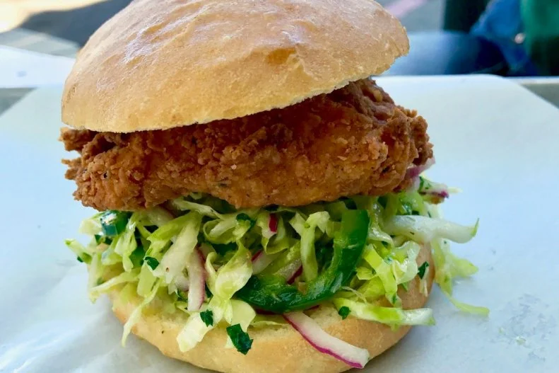 Oakland residents have been counting their lucky stars ever since Australian expat and Chez Panisse alum Alison Barakat opened the doors to Bakesale Betty back in 2005. The Temescal shop still regularly gets lines down the block of eager locals and tourists angling to get a taste of the buttermilk fried chicken and coleslaw sandwich. The perfectly breaded plump and juicy breast is well balanced with a vibrant spicy slaw. And, for those who don’t eat meat (this is California, after all), the place offers a vegetarian tofu version that also has a cult fan base.