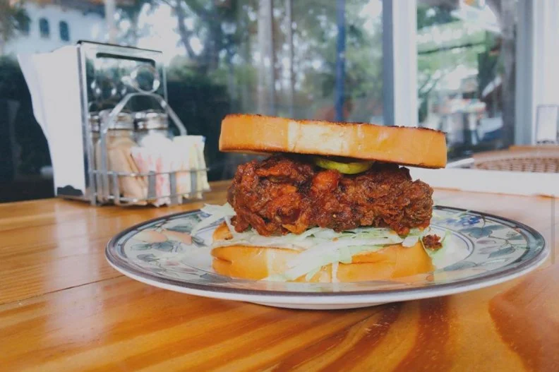 This Miami Cuban diner by Chef Michael Beltran of highly acclaimed Ariete, one of the best restaurants in bustling Coconut Grove, offers traditional American diner fare with a South Florida twist, like cast-iron skillet pancakes and eggs with black beans and fried sweet plantains. Another perfect example of the Miami-style fare is the hot fried chicken sandwich. Chicken thighs are seasoned with sazon completa, battered and deep-fried until nice and crisp, then tossed in a fiery plantain sauce. The zesty meat is layered with lettuce and housemade bread-and-butter pickles on toasted white bread.