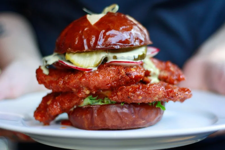Emmy Squared may be best known for bringing Detroit-style pizza to the slice capital of the world, but the place is also hailed for its burgers and a unique spicy chicken sandwich. Its special fried chicken dish gets its kick — and crunch — from an inspiring combination of ingredients from all over the world. Each order starts with two chicken cutlets marinated in buttermilk and gochujang, a savory, sweet and spicy fermented chile paste from Korea. Those tenderized hunks are crusted with Japanese panko, thrown in the fryer and tossed in a sweet Indonesian-inspired sambal sauce. The juicy poultry is layered atop bok choy, then topped with pickles, radish and a housemade ranch dressing.