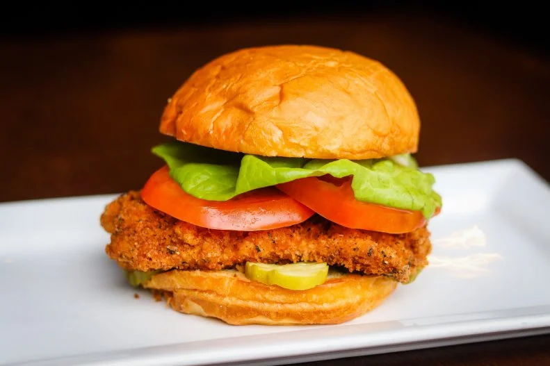 One of the few items at Northbound Smokehouse that doesn’t come out of the smoker, this chicken sandwich is familiar, sort of like something your grandmother would have made for a picnic — if she were a really great chef. According to the proprietors, this homespun dish embodies the motto “Slow down, take your time and do things perfectly every time.” Seasoned panko batter creates a dense, crunchy crust on the deep-fried breast, which gets balanced out with dill pickles, lettuce, tomato and a sweet and savory roasted-garlic mayo on a toasted egg bun.
