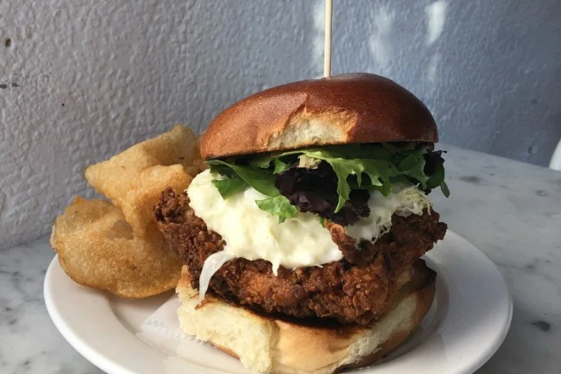 This Insta-worthy Lawrenceville cafe is known for serving some of the most aesthetically pleasing food in the Rust Belt. While its Crispy Chicken Sandwich may not be the most-photogenic dish on the menu, it’s certainly one of the most popular, because it’s got a whole lot of flavor going on. Chicken breast is brined daily in a combo of buttermilk and pickle brine, then it's floured and fried until crispy. Guests who order it spicy get their bird tossed in house -ermented hot sauce, a tasty addition to the flavorful accoutrement of mustard seed-infused bread-and-butter pickles and thinly shaved napa cabbage slaw accented with housemade aioli and a touch of vinegar.