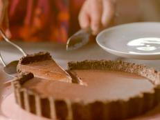 I have always avoided making chocolate tarts, not out of laziness (I love a bit of pastry-making, in the right mood), but because I have never really felt that the pastry served the chocolate, or was worth the effort here. This is my simple solution: make a base out of chocolate cookies. And the filling is just as easy to make, too. Not that you'd know from the taste. I never lie about how effortless something is to make, but no one will believe me on this one. I think the hit of salt is crucial: it subtly counters the richness of all the chocolate, so even if you don't normally go in for the sweet-salt combo, don't be tempted to leave it out. Halve the amount of salt, if you must. I am having a bit of a smoked salt moment and urge you to try the flakes in general and, in particular, here. If you want to, of course, you can use Bourbon biscuits for the base: Oreos give that dramatic espresso-blackness, but the more Aztec-earth brown of the Bourbon base will highlight the darkness of the filling.
