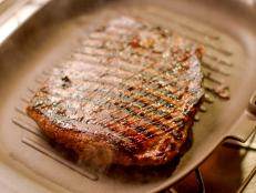 Skirt or flank steak is eaten a lot in America, and in France, but hardly at all here in the UK. This is madness, as it is so much cheaper than any other sort of steak and so rich in flavor. I think what has put people off in the past is that, in Britain, it has been cooked in low and slow braises, which turns it into shoe leather. Bavette is the external part of the skirt (onglet being the internal connecting tissue) and all you need to do to cook it is, as my butcher puts it, "sear the hell out of it and serve it rare." I find 2 minutes a side on a very hot, ridged griddle optimum, but this does mean it's only for those who like their steak blue. The other key point is how you carve it: it must be sliced against the grain. That holds true with all steak, but with a cut like bavette, it will be inedibly chewy if you disobey. Luckily, the grain is very so it's very easy to identify and then cut across it.

You don't have to get the whole piece. I don't like cooking individually cut steaks, as it's all in the fine slicing as far as I'm concerned, but a 500-gram (1-pound) piece will be plenty to feed 4, and is the size I often go for, cooking it for exactly the same amount of time as indicated below.

The tamarind and soy marinade tenderizes the meat, but also gives such a glorious tanginess (I have a sour tooth). I keep Thai tamarind paste, which is condensed almost into a brick, in my fridge, and that's why I proceed as below. But if you are using tamarind paste out of a jar (and which tends to be runny), then use 75 milliliters (2.6 ounces) and simply add it to the rest of the marinade ingredients, without cooking it or adding water. Either is fine, but it just so happens that the genuine article is better, and less expensive.

I serve this thinly sliced, as if it were a joint of beef, but it would also make for fantastic beef tacos, and is wonderful cold, stuffed into a baguette or tossed into a salad, so leftovers are a real boon.