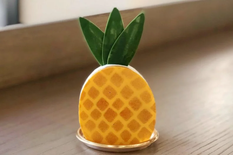 Everything Dominique Ansel creates has a certain level of whimsy, even if it’s a piece that requires intricate detail. For example, his California bakery is home to a pineapple passion-fruit tart that looks like a mini pineapple. It’s made with homemade pineapple compote, lime mousse and passion fruit ganache that’s sandwiched between layers of pâte sablée and topped with green leaves fashioned from white chocolate.