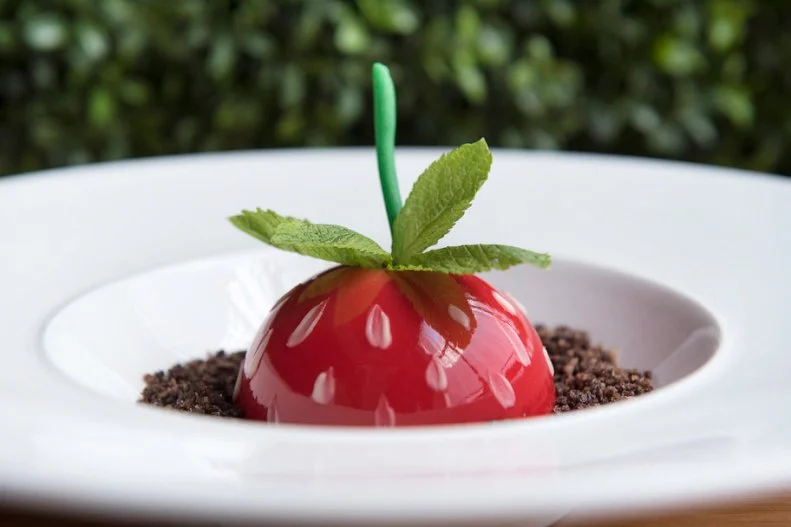 This very seasonal spot, where the menus and decor shift seasonally, pays homage to the bounty of produce found at each time of year. The summer menu contains a playful dessert that looks like a strawberry growing out of the soil (there was a similar carrot dessert for spring): a strawberry chocolate mousse with a pistachio creme brulee filling, served on a bed of chocolate panko “dirt.” 