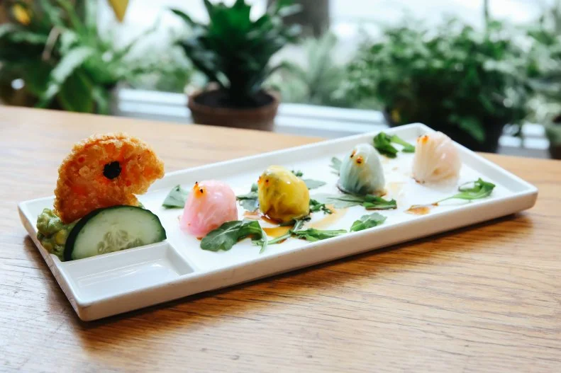 This modern Chinese food spot dishes out some delicious menu items with fun variations on fried rice, like BBQ duck and ginger, bacon and egg, shrimp and scallop. But don’t miss out on the real fun with their variety of dumplings, especially the Pac-Man shrimp dumplings. The plating makes it look like a scene out of the video game with Pac-Man as a tempura sweet potato slice and the ghosts as pastel-colored shrimp dumplings ready to be chomped up quickly.