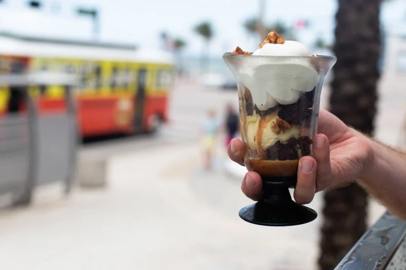 This is a fun spot to indulge in Baja cuisine, with plenty of tacos, ceviche and guacamole, as well as an unexpected treat — the signature ice cream sundae. This sundae takes all the goodness of a regular hot fudge sundae and gives it a twist. Made with Mexican vanilla bean ice cream, drizzled with cajeta (Mexican caramel sauce) and topped with chile chocolate brownie pieces and a handful of peanuts, it’s sure to be the perfect end to the meal.