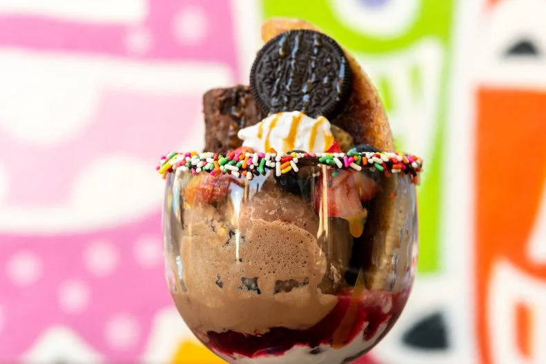 No dairy, no problem. This vegan sundae is so delish that you wouldn’t even know it had no milk or cream in it. It starts with a homemade black bean brownie that’s topped with a vegan ice cream from local and artisanal ice cream shop Nourish Creamery. The sundae is rounded out with a few caramelized bananas, coconut shreds and fresh berries on top and then is served in a bowl with a sprinkled rim.