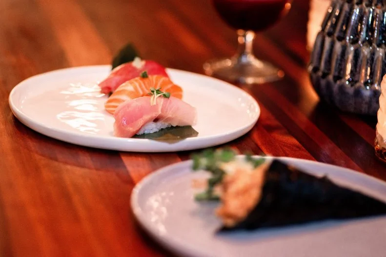 <a target="_blank" href="https://www.acrossthepondphx.com/">Across the Pond</a> is an intimate, incredibly focused little sushi spot located across the breezeway (or pond) from its parent restaurant, Clever Koi. The menu favors quality over quantity, so close your eyes and savor their delicate nigiri or light and other-worldly sashimi. Luxuriate in the umami of their toro, or enjoy the slight crunch of a soft shell crab roll. The mixology program is as refined as the sushi, featuring a few faves from Clever Koi across the pond.
