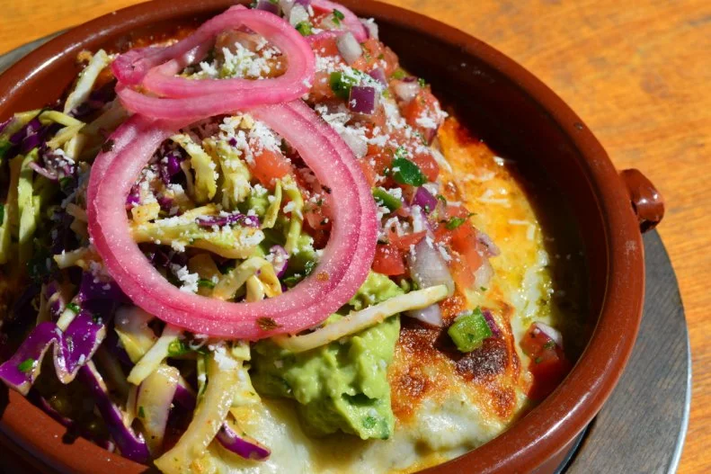 Forget everything you know about the enchilada before you head to <a target="_blank" href="https://www.gadzooksaz.com/">Gadzooks</a>, a fast-casual spot that "redefines the enchilada." Each one is built to order in a clay dish and finished off in a pizza-like oven so everything's ooey-gooey and the flavors are married like they mean it. We love the "festival chicken" with shredded chicken, cornbread stuffing, in mixed flour and corn tortillas, topped with pickled red onions, slaw and cotija cheese.