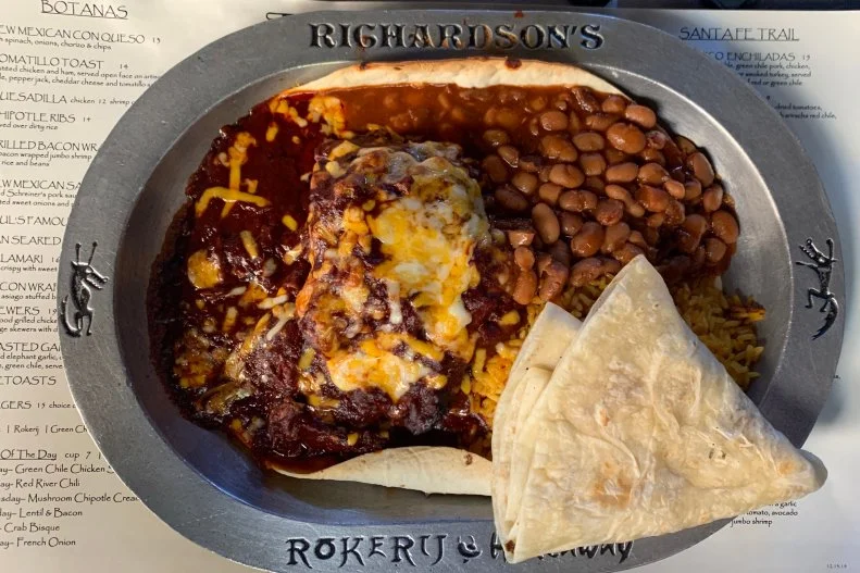 <a target="_blank" href="http://www.richardsonsnm.com/">Richardson’s</a> is a magical space that offers a taste of New Mexico in a way even New Mexico can’t quite replicate. Owner Richardson Browne’s small empire of restaurants (Dick’s Hideaway and The Rokerij) has been guided by this flagship since 1988, where likely over 1 million carne adovadas have been sold. It’s an iconic dish, with tender, pull-apart shreds of pork, spicy adovada sauce and side of rice and beans, all on a plate-sized tortilla. Add a green chile sweet potato and house salad on a chilled plate to complete any meal. 