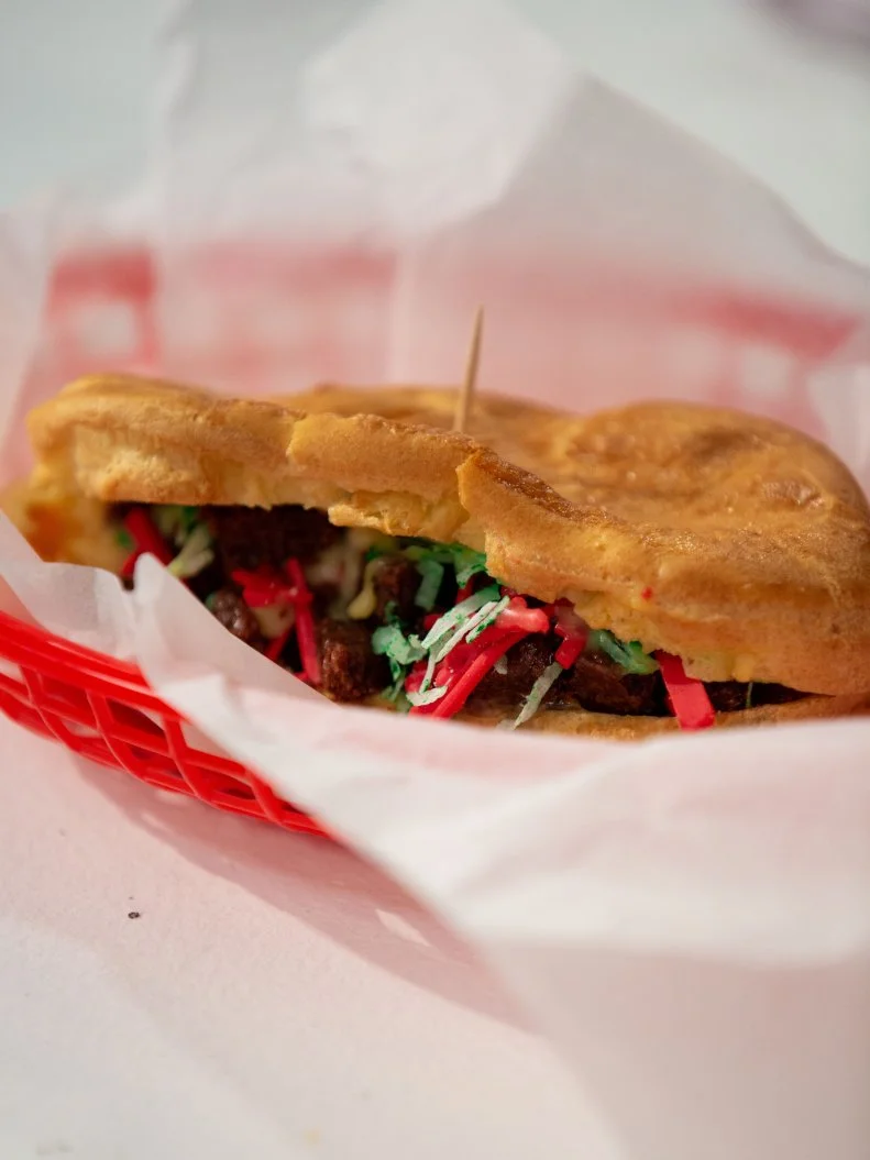 Avner's final dish - Cheesesteak on a Roll, Twist: Coleslaw - BROWNIE CHEEESTEAK ON A PATE A CHOUX ROLL, PASTRY CREAM "CHEESE," COCONUT LETTUCE AND COATING CHOCOLATE PEPPERS  WITH COATING CHOCOLATE, COCONUT & CREAM CHEESE COLESLAW, as seen on Kids Baking Championship, Season 8.