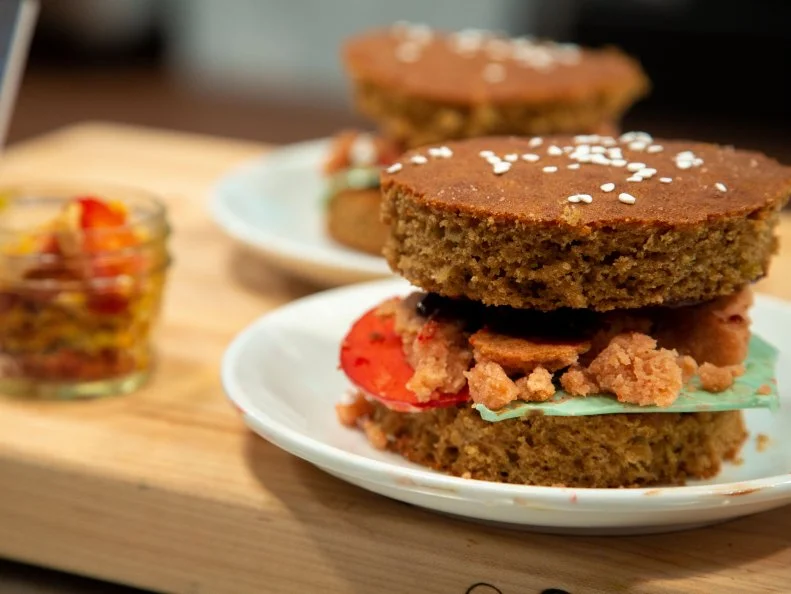 Sam's final dish - Pulled Pork on Sesame Bun, Twist: Dill Pickle - SPICED CAKE SESAME BUN, BLONDIE PULLED PORK, APPLE TOMATOES, WHITE CHOCOLATE LETTUCE AND CHOCOLATE CARAMEL BBQ SAUCE,WITH WHITE CHOCOLATE COATED STRAWBERRY DILL PICKLES, as seen on Kids Baking Championship, Season 8.
