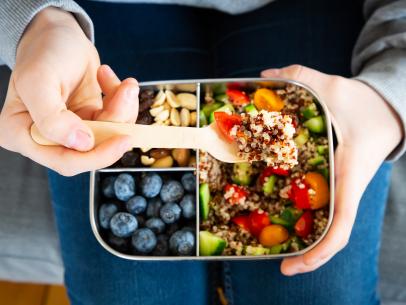 https://food.fnr.sndimg.com/content/dam/images/food/fullset/2020/01/21/0/FN_kid-with-lunchbox-with-quinoa-salad-GettyImages-1140201754_s4x3.jpg.rend.hgtvcom.406.305.suffix/1579623985491.jpeg