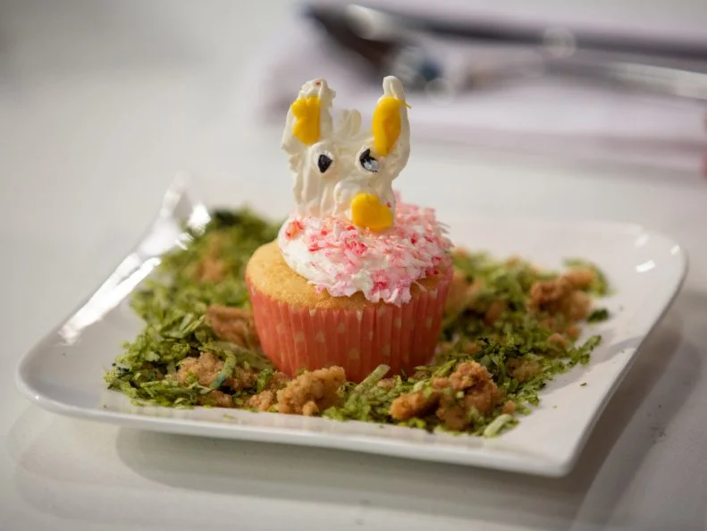 Graysen's final dish - COCONUT CUPCAKE WITH TOASTED COCONUT, CARMELIZED PINEAPPLE FILLING, COCONUT MILK BUTTERCREAM WITH,GREEN COCONUT GRASS AND BROWN SUGAR CRUMBLE DIRT, as seen on Kids Baking Championship, Season 8.