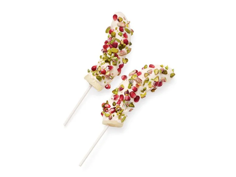 Halve 3 bananas crosswise; insert a lollipop stick or wooden pop stick into each. Freeze until firm, about 3 hours. Dip in 1 cup whole-milk vanilla yogurt to coat and sprinkle with pomegranate seeds and chopped pistachios. Freeze until set.