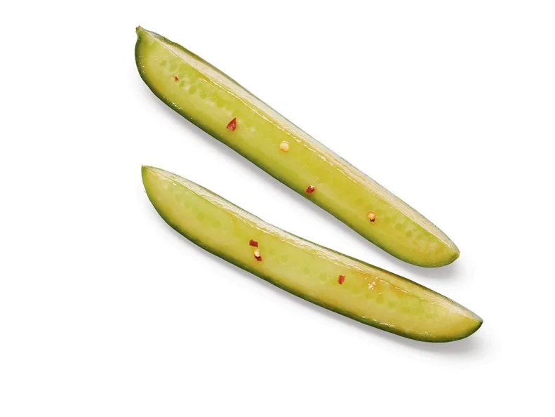 Mix 2 tablespoons each rice vinegar and soy sauce, 1 tablespoon honey and 1 teaspoon toasted sesame oil in a shallow dish. Add 4 Persian cucumbers (quartered lengthwise) and a pinch of red pepper flakes. Toss well and refrigerate 30 minutes. Drain and sprinkle with salt.