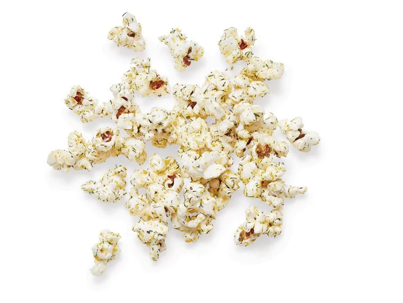 Mix 1/4 cup nutritional yeast with 1 1/2 teaspoons dried dill, 1 teaspoon kosher salt and 1/2 teaspoon each garlic powder, onion powder and pepper. Heat 2 tablespoons olive oil in a large pot over medium heat with 3 popcorn kernels. When they pop, add 1/2 cup popcorn kernels, partially cover and cook, shaking the pot occasionally, until the popping subsides. Toss the popcorn with 3 more tablespoons olive oil and the seasoning mixture.