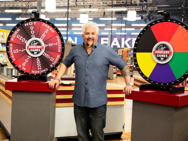 Host Guy Fieri and the Food Wheels for Game 3, Food Wheel, as seen on Food Network's Guy's Grocery Games, Season 2.