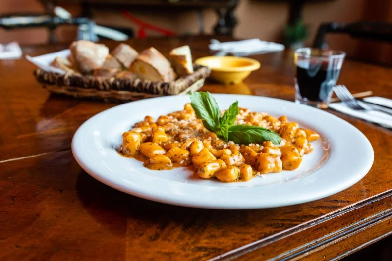 If you’re searching for a place like that gem you found while touring Italy, look no further than <a target="_blank" href="https://www.andreoli-grocer.com/">Andreoli Italian Grocer</a> in Scottsdale. Grilled calamari, carpaccio and the best porchetta outside of Rome are on the main menu, while daily specials often feature pastas and fish (You should hope they have branzino when you visit.). The dining room doubles as a market for all manner of Italian groceries.