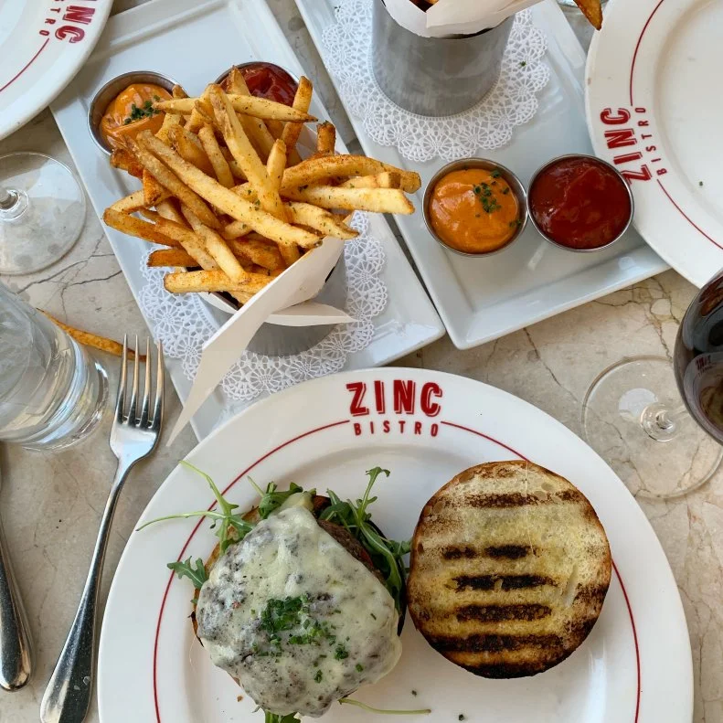 Little has changed about <a target="_blank" href="https://zincbistro.com/">Zinc Bistro</a> in its two decades, and for good reason. At this authentic French bistro, co-owners Matt Carter and Terry Ellisor (both of The Mission and Fat Ox), strike all the right notes. Sit on the wrap-around patio and imagine Kierland Commons is Boulevard Saint-Germain (it takes couple glasses of Champagne for this to work), or head through the restaurant to the secluded garden patio. Then dig into Carter’s classic escargot bourguignon, chateaubriand for two, soul-satisfying bouillabaisse or a traditional onion soup with bubbling Gruyere. Snag a seat at the raw bar and you’ll be singing oui, oui, oui all the way home.