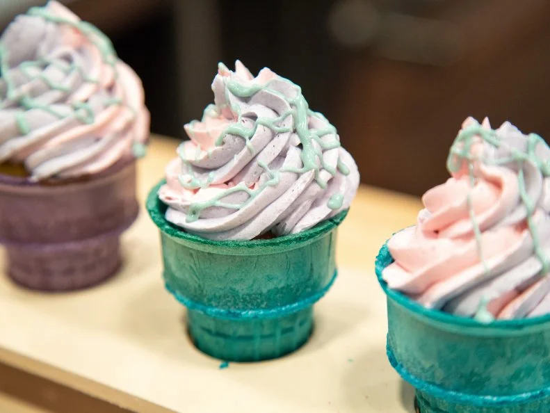 Sam's final dish - VANILLA CITRUS TIE-DYE CUPCAKE WITH SWISS MERINGUE BUTTERCREAM AND WHITE CHOCOLATE DRIZZLE,WITH VANILLA BEAN ICE CREAM WITH RASPBERRY COULIS SWIRL, as seen on Kids Baking Championship, Season 8.