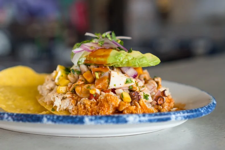 Off the strip, in prime real estate at the groovy Fergusons development downtown, La Monja showcases the robust flavors of Mexican coastal cuisine. Chef Dan Krohmer creates bold dishes like the habanero-spiced octopus aguachile and crisp tostadas layered with sea bass, avocado and macha salsa. If you can’t handle the heat, cool your palate with a buñuelo, a churro- and waffle-inspired deep-fried pastry dusted heavily with cinnamon and sugar and finished off with a creamy scoop of vanilla.
