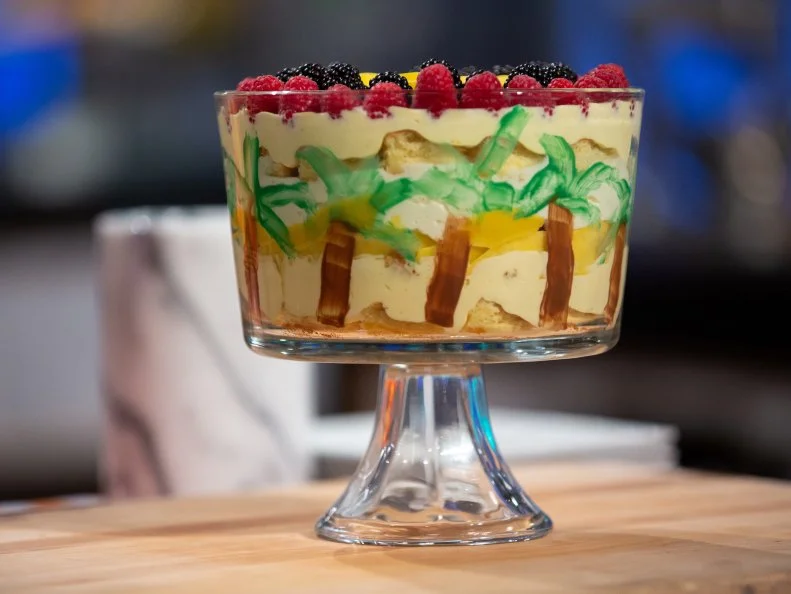 Reggie's final dish - VANILLA POUND CAKE WITH PASSIONFRUIT CURD, PASSIONFRUIT DIPLOMAT CREAM, AND COCONUT MOUSSE, TOPPED WITH RASPBERRIES, BLACKBERRIES, AND MANGO,WITH COCONUT, CASHEW, AND CRANBERRY GRANOLA, as seen on Kids Baking Championship, Season 8.