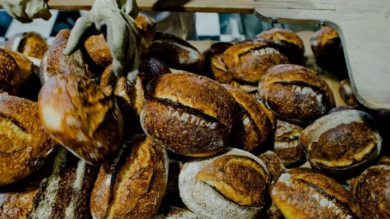 Since Chad Robertson and Elisabeth Prueitt founded <a target="_blank" href="http://www.tartinebakery.com/">Tartine</a> in 2002, their philosophy has been centered on making the best, most flavorful bread possible. A wood-fired oven is responsible for yielding dark, blistered loaves, while a long fermentation produces the signature open crumb and a subtly sweet tang. But the pair firmly believe that better grains equals better flour, which in turn equals better bread. That means working with local mills such as Camas Country Mill, and Cairnspring Mills for their staple bread flour. The Country Loaf is a sterling example of what that flour can do: some of the coarsest bran is removed so the flour retains the softness needed for a tender crumb, but most of the bran, germ and oils stay in the flour, creating a deeply flavorful and nutritious loaf of bread, Head baker Jen Latham likens having access so many different varietals of wheat to going from baking only with vanilla to a whole pantry full of spices. And Tartine’s bakers aren’t the only ones inspired. On the café side, the chefs dream up dishes where breads share equal billing. To wit, a recent special of braised short ribs with sour cream and XO sauce called for charred einkorn flatbread, perfect for mopping up all that luscious sauce. Next, they’re working to perfect a sourdough Sonora flour tortilla.