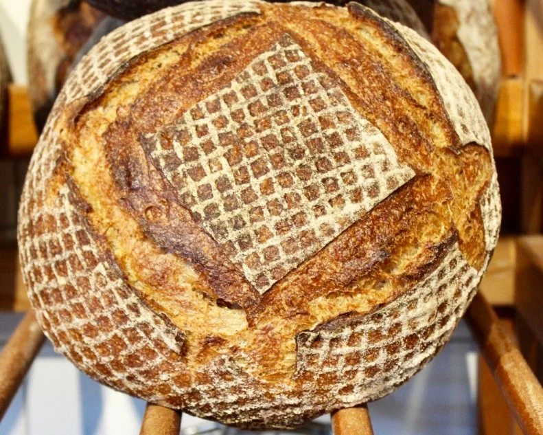 Since <a target="_blank" href="http://www.sevenstarsbakery.com/">Seven Stars Bakery</a> opened in Providence in 2001, its mission has been simple: Bake great stuff. For head baker Sarah Williams, that means using flavorful, freshly milled flour. Since 2015, all flours are stone milled in-house from grains sourced from Maine Grains, including Glenn (a hard-red spring wheat), rye, spelt and oats — to the tune of 2,500 pounds of flour a week. Additionally, Williams opts not to sift any of the bran off the whole grain flour, yielding flours that are 100% whole grain. Each loaf of bread starts with over 50% freshly milled whole wheat flour and/or a 100% whole rye starter, before undergoing a slow fermentation process. It takes three days for a loaf to reach the bakery shelf, and those slow fermenting starters are what imbue the breads with deep flavor and a hint of natural sweetness, not to mention superior texture and a longer shelf life. Try the signature country bread, a rustic, savory sourdough made from a blend of Glenn and rye flours that has a balanced buttery-earthy-tangy flavor profile. In addition to its Providence outposts, Seven Stars also counts locations in Cranston and Pawtucket, and supplies bread to dozens of local restaurants and Rhode Island universities such as Johnson & Wales and Brown.