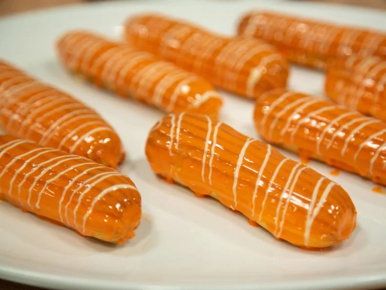 Aisha's preheat dish - AISHA: Butterscotch Éclair with Orange Glaze, as seen on Spring Baking Championship, Season 6.