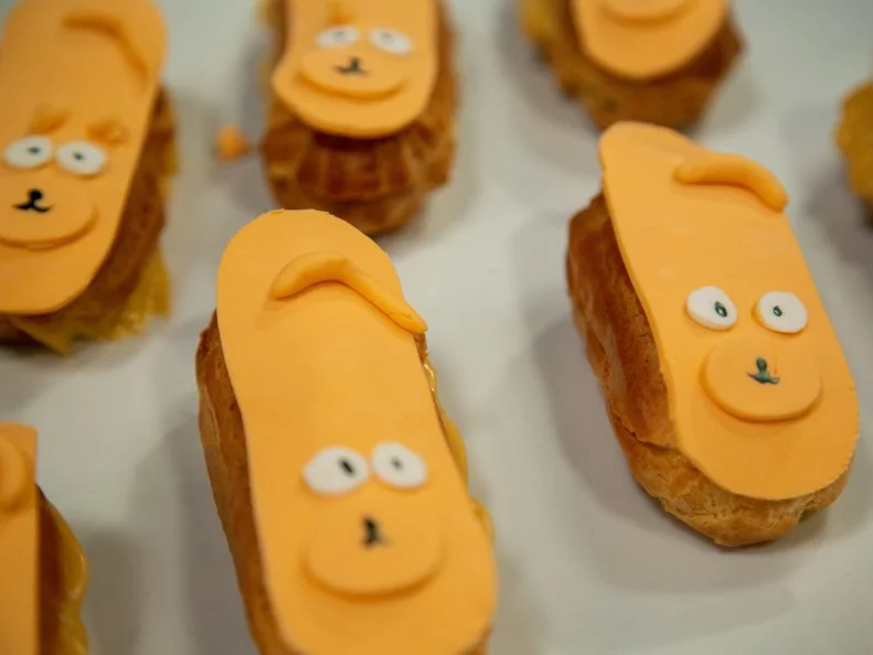 Arin's preheat dish - ARIN: Butterscotch and Cherry Éclair with Vanilla Glaze, as seen on Spring Baking Championship, Season 6.