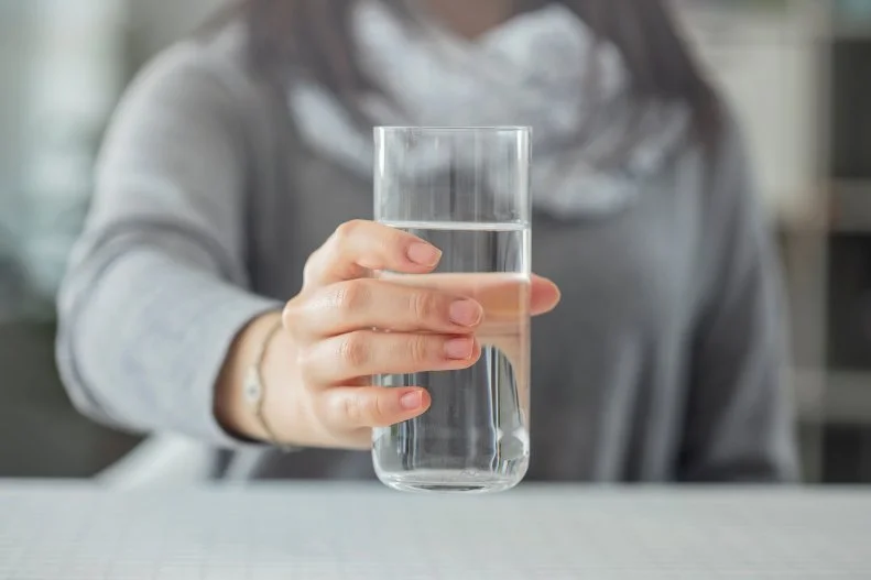 Many dietitians tend to grab for a glass of water including Michele Fumagalli, RD, LDN owner of Fit Plate Nutrition a private practice that empowers women and athletes to relearn how to nourish and fuel their body and minds. Fumagalli says that every morning she reaches for a 10 to 12 fluid ounce glass of water before touching her coffee, tea, or eating breakfast. "My husband and I even keep each other in check with this," which is a great way to stay accountable! Fumagalli explains that water makes up 60% of our body. "Organs, tissues and many bodily functions rely on water to function properly and optimally. Thus, it's obvious that hydration is important, so why not start first thing in the morning? After waking up from your 7-8 hour slumber (hopefully), the body is in a dehydrated state and yearning for water." Fumagalii doesn't claim any miraculous result from drinking water first thing in morning other than getting ahead of the hydration game. 